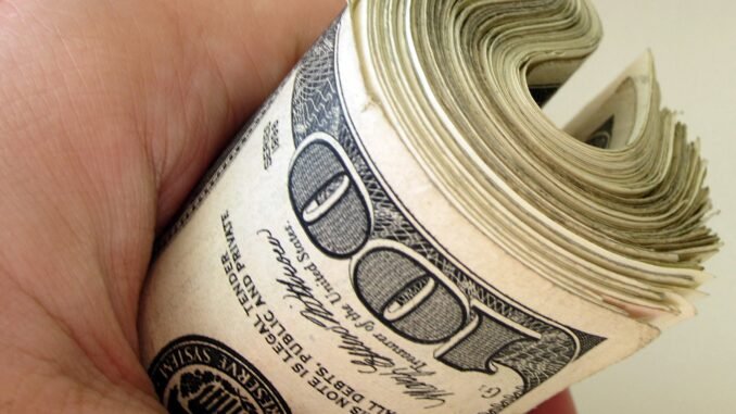 Image of bankroll to illustrate article on AI financial planning.