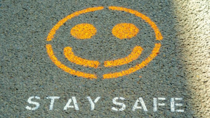 Stay safe written on the floor as Anthropic has detailed its safety strategy to try and keep its popular AI model, Claude, helpful while avoiding perpetuating harms.